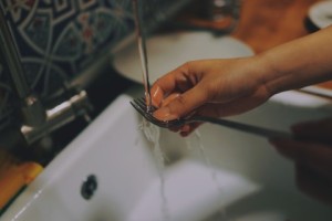 a fork being washed
